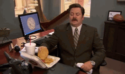 Ron Swanson Eating Burger Like Popcorn Meme
