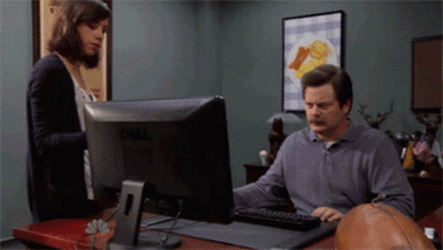 Ron Swanson Throwing Computer Into Garbage Container GIF