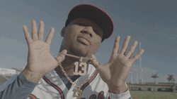 Ronald Acuna Jr Showing Off 13 Pendant GIF