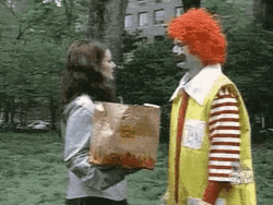 Ronald Mcdonald Clown Throws Woman's Mcdonalds Meal  GIF