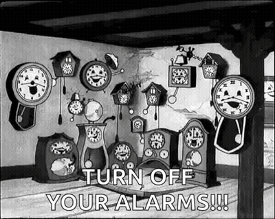 Room Filled With Clocks And Turn Off Alarms Sign GIF