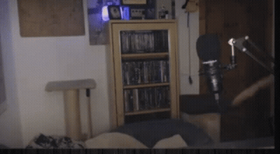 Room With Bookshelf, Microphone, And Cat Tree GIF