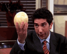 Ross Geller Holding A Huge Egg GIF