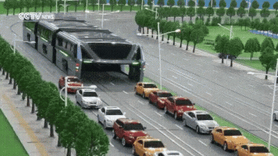 Row Of Cars Driving Down Street With CCTV News Sign GIF