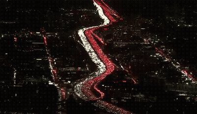Row Of Cars Lined Up On Road GIF