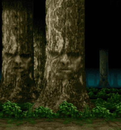 Row Of Carved Face Trees GIF