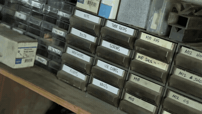 Row Of Drawers Labeled Nuts Bolts Screws Ice Cubes Nails GIF