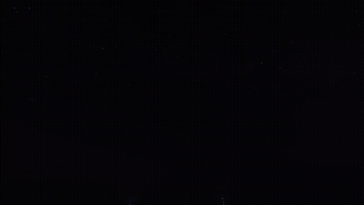 Row Of Fireworks In Dark GIF