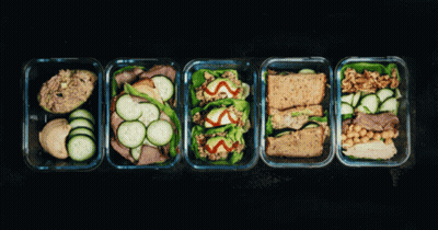 Row Of Glass Containers Filled With Food Labeled Sunday GIF
