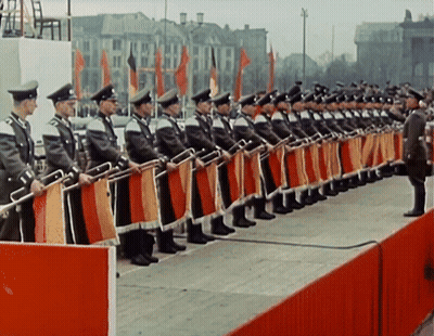 Row Of Men In Military Uniforms Standing In Line GIF
