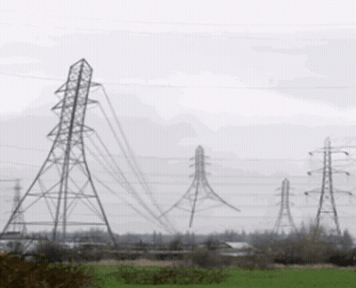 Row Of Power Lines Through A Field GIF