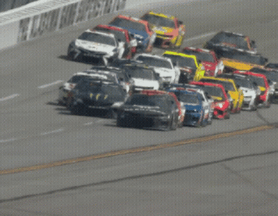 Row Of Race Cars On Track GIF