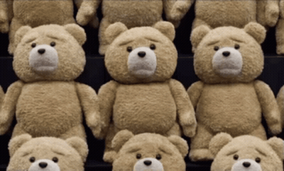 Row Of Teddy Bears With Sad Faces GIF