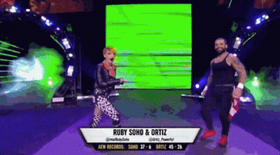 Ruby Soho And Ortiz Are Dancing On A Stage GIF