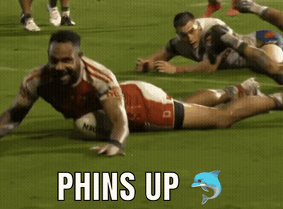 Rugby Player Laying Down With Phins Up GIF
