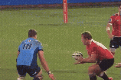 Rugby Player Number 23 Being Tackled GIF