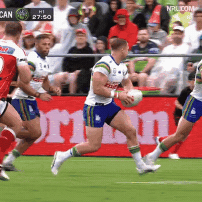 Rugby Players Running In Front Of NRLcom Sign GIF