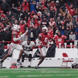 Running High Five Huskers Players GIF