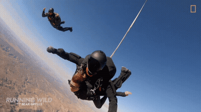 Running Wild Bear Grylls Two People Parachuting GIF