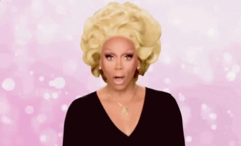 Rupaul Is Wearing A Wig And A Black Top And Is Asking A Question . GIF
