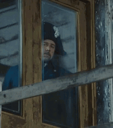 Russell Crowe Looking Out The Window GIF