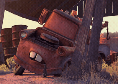 Rusty Tow Truck Leaning Against Wooden Post GIF