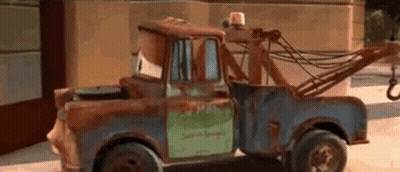 Rusty Tow Truck Parked On Side Of Road GIF