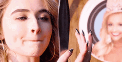 Sabrina Carpenter Looking At A Mirror GIF