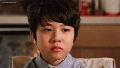 Sad Boy Sitting In Chair Eyes Closed GIF