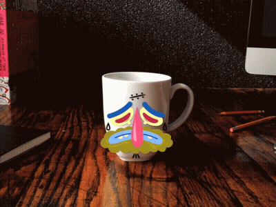 Sad Face Mug On Wooden Desk GIF