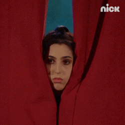 Sad Girl Sneaking Behind Curtains  GIF