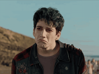 Sad Man In Plaid Shirt And Denim Jacket GIF