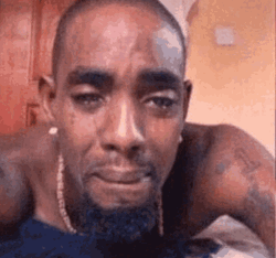 Sad Meme Of Black Guy Lying GIF