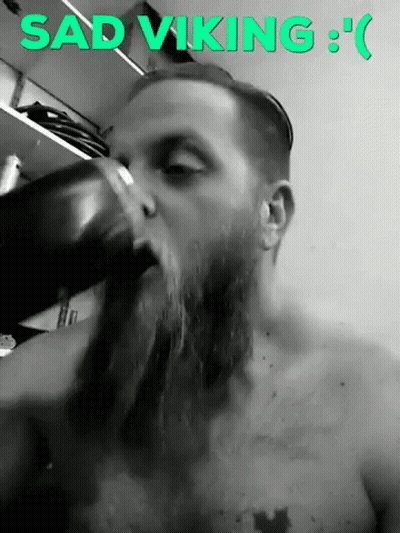 Sad Viking Man With Beard Drinking From Cup GIF