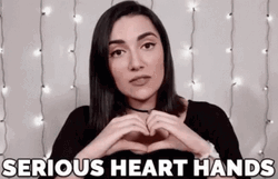 Safia Nygaard Serious Heart Hands GIF