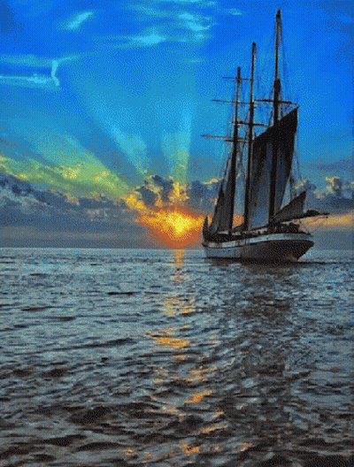 Sailboat In Ocean At Sunset GIF