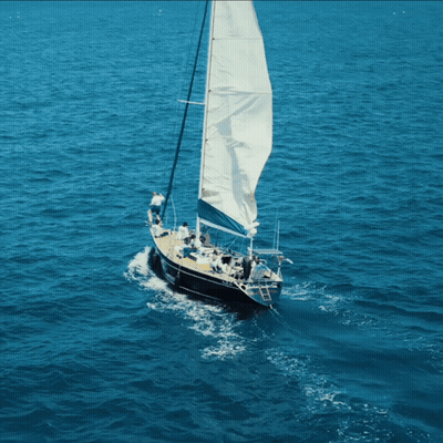 Sailboat With Large Sails In Ocean GIF