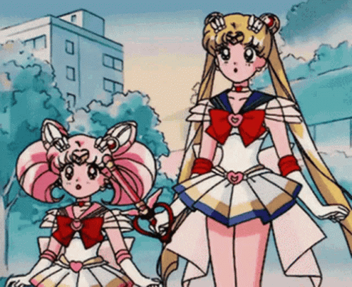 Sailor Moon And Chibi Moon Are Standing Next To Each Other In A Cartoon GIF