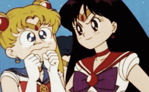 Sailor Moon And Mars Are Standing Next To Each Other And Looking At Each Other GIF