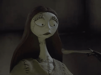 Sally From The Nightmare Before Christmas Has Stitches On Her Face And Neck GIF