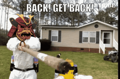 Samurai Holding Man's Arm In Front Of House Saying Back Get Back GIF
