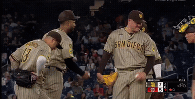 San Diego Baseball Players Shake Hands With Each Other During A Game GIF