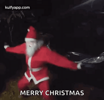Santa Claus Dancing In Front Of Car In Dark GIF