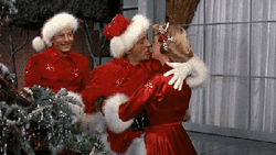 Santa Claus Hugging Woman GIF