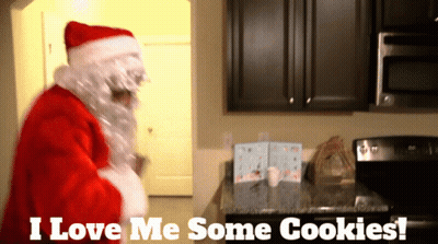 Santa Claus In A Kitchen With The Words " I Love Me Some Cookies " Above Him GIF