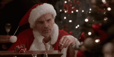 Santa Claus Smoking Cigarette At Table GIF