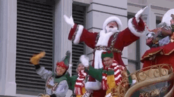 Santa Claus With Elves Waving GIF
