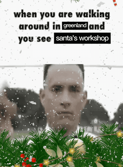 Santa's Workshop Poster With Man In Foreground GIF