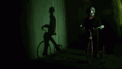 Saw Billy The Puppet Riding Bicycle GIF