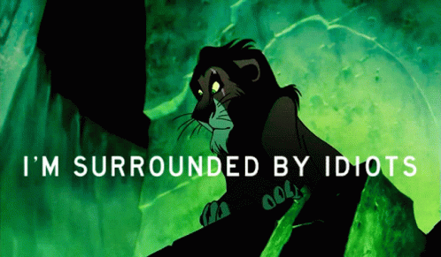 Scar From The Lion King Sits On A Rock With The Words I 'M Surrounded By Idiots Above Him GIF